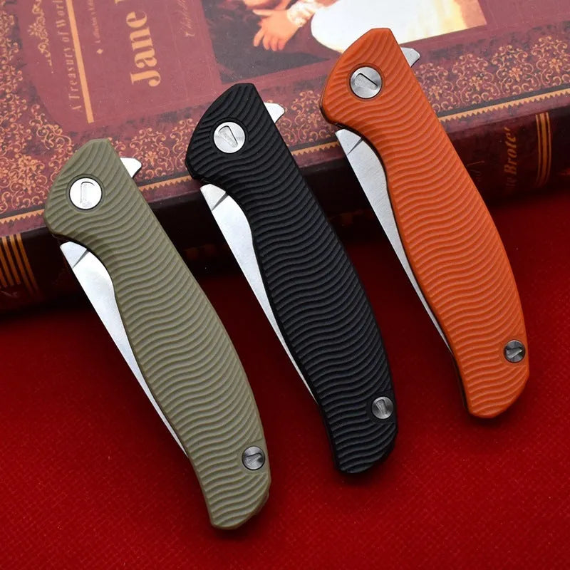 Outdoor folding knife with D2 steel blade, 9.6 cm blade length, 4.0 mm edge thickness, and nylon glass fibre handle in Black or Orange