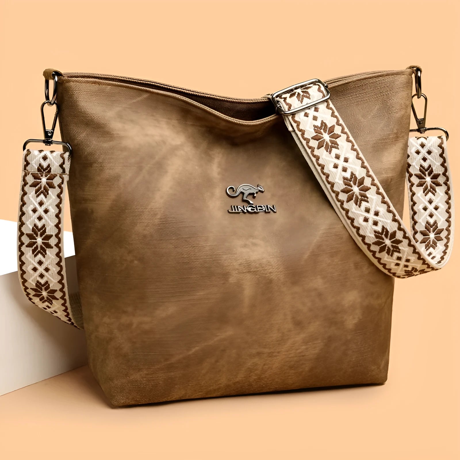 Soft PU leather women's crossbody bag in grey, pink, or yellow with an adjustable strap