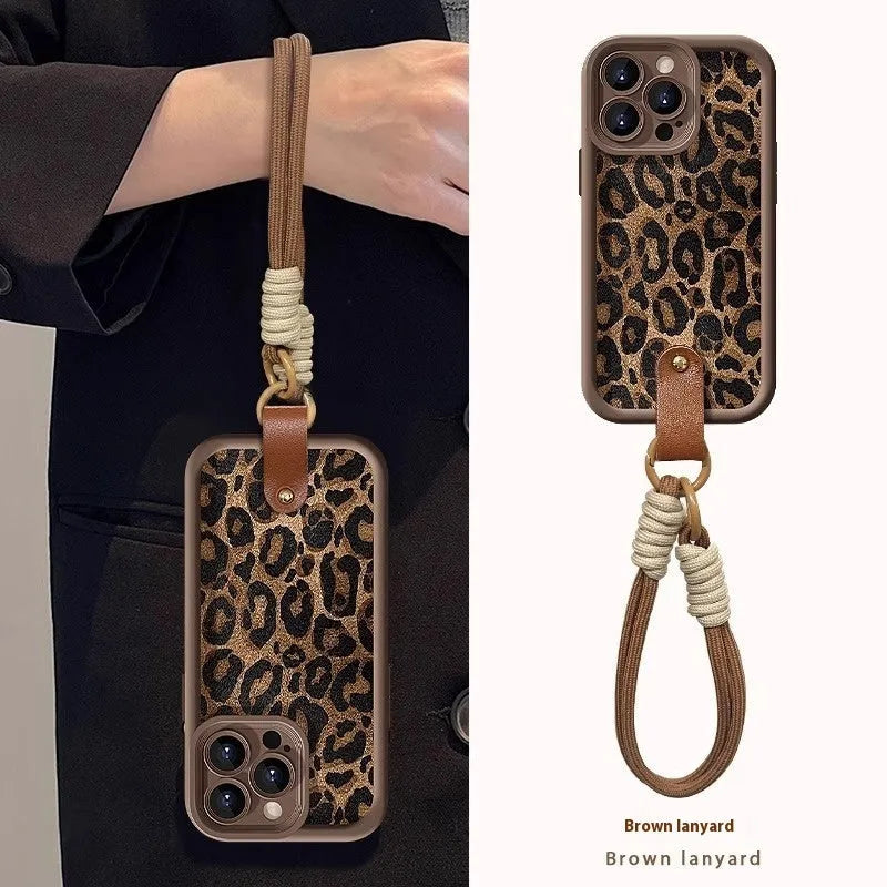 Brown leopard print silicone lanyard case for iPhone with hands-free strap.