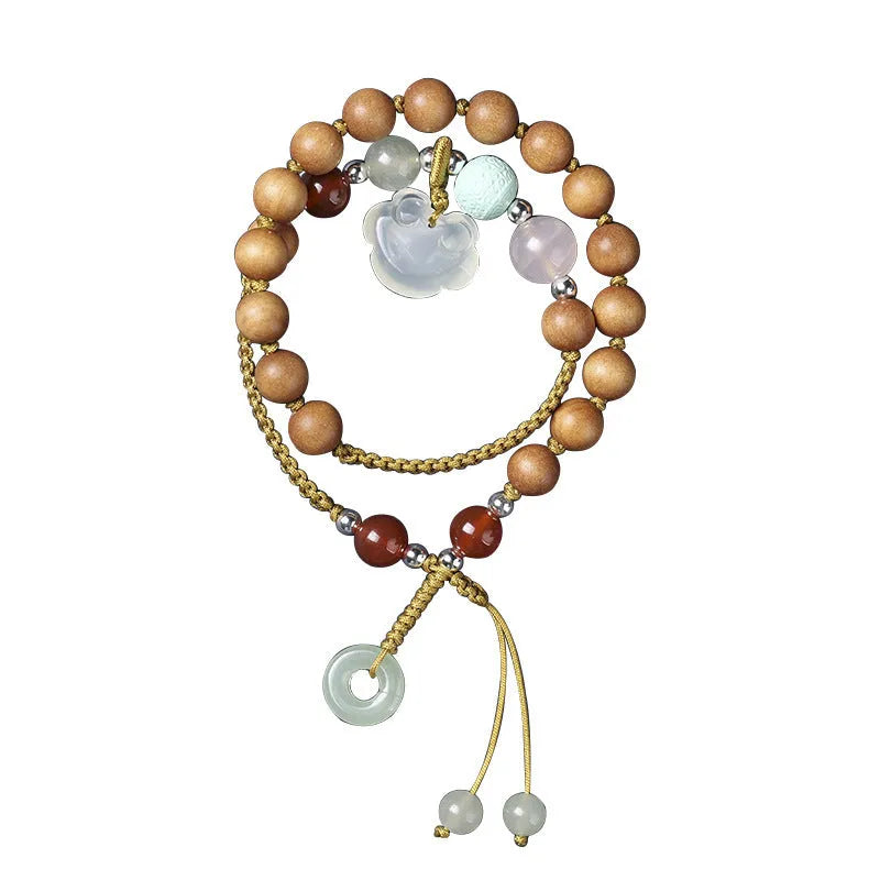 Hand-woven women's sandalwood bracelet with double-ring design and traditional gemstone accents