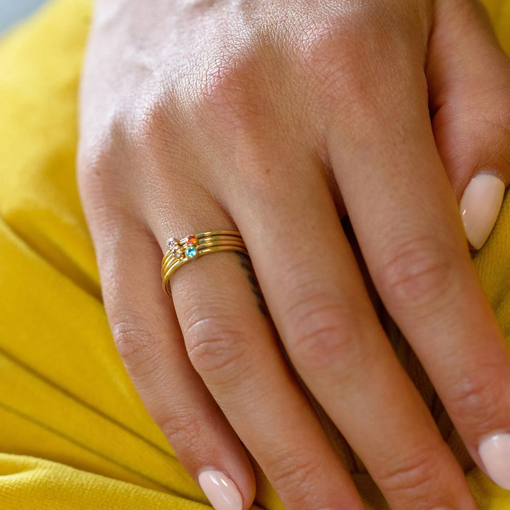 A geometric titanium steel ring featuring a December birthstone engraving.