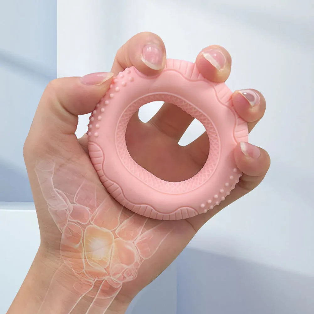 Silicone hand grip ring in five colours showing textured surface and compact 7.4cm size for finger and forearm strength training