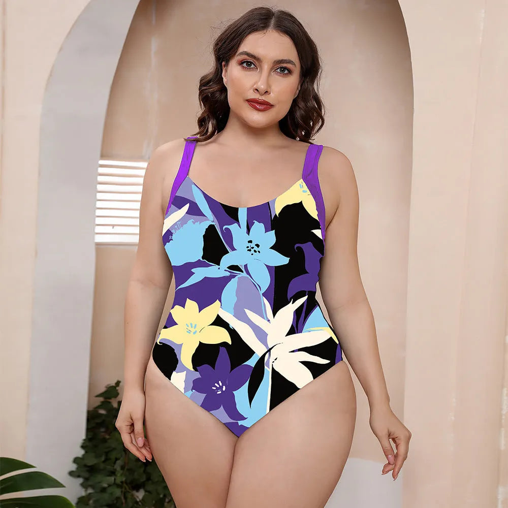 Conservative one-piece floral print swimsuit with spaghetti straps and vest top on a mannequin.