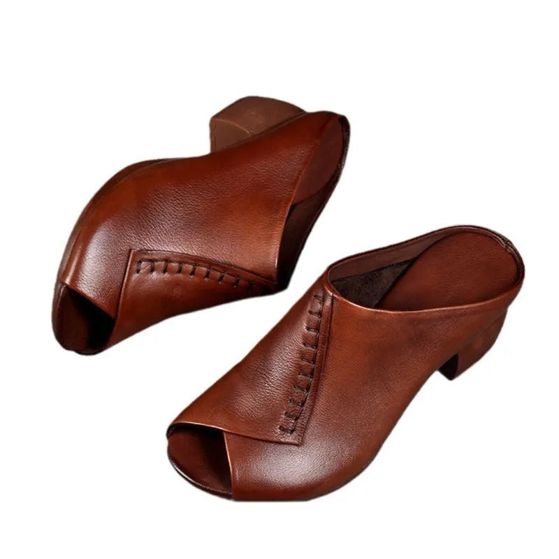 Women's black square heel peep-toe slippers with a fish mouth scaffold design on a rubber sole.