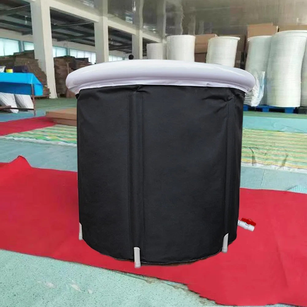 Black inflatable portable ice bath tub with elasticated cover, shown with air pump and drainage accessories