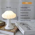 Wood grain coloured mushroom-shaped touch lamp with USB charging port on a bedside table.