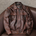 Men's brown plus size lapel leather jacket with side pockets on a hanger