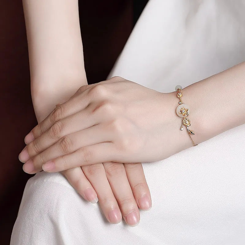Hetian jade lotus peace buckle women's bracelet in 925 silver with antique design