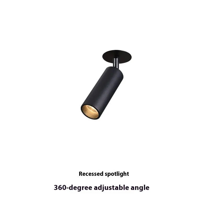 Black and white embedded cylinder LED spotlight for track lighting with selectable power and colour temperature settings.