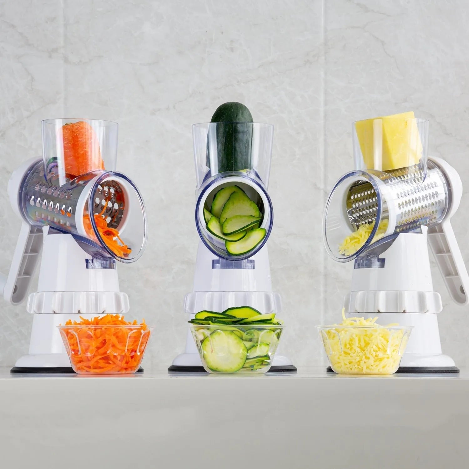 White plastic manual vegetable slicer with rotating drum and suction feet