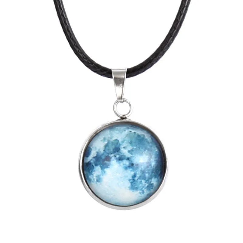 Luminous Christmas moon and starry night sky pendant necklace on a chain with extension.