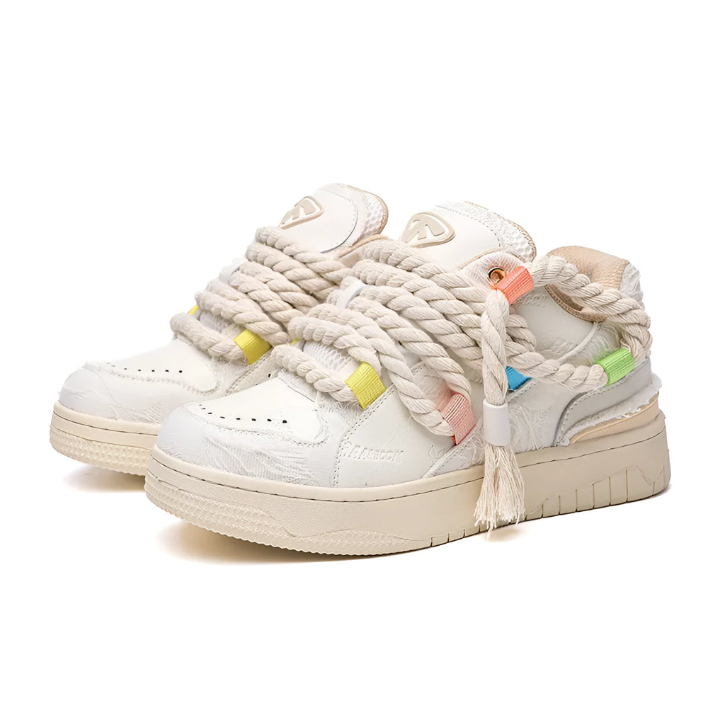 Creamy white Old Damage retro skate shoes with lace-up front and platform sole.