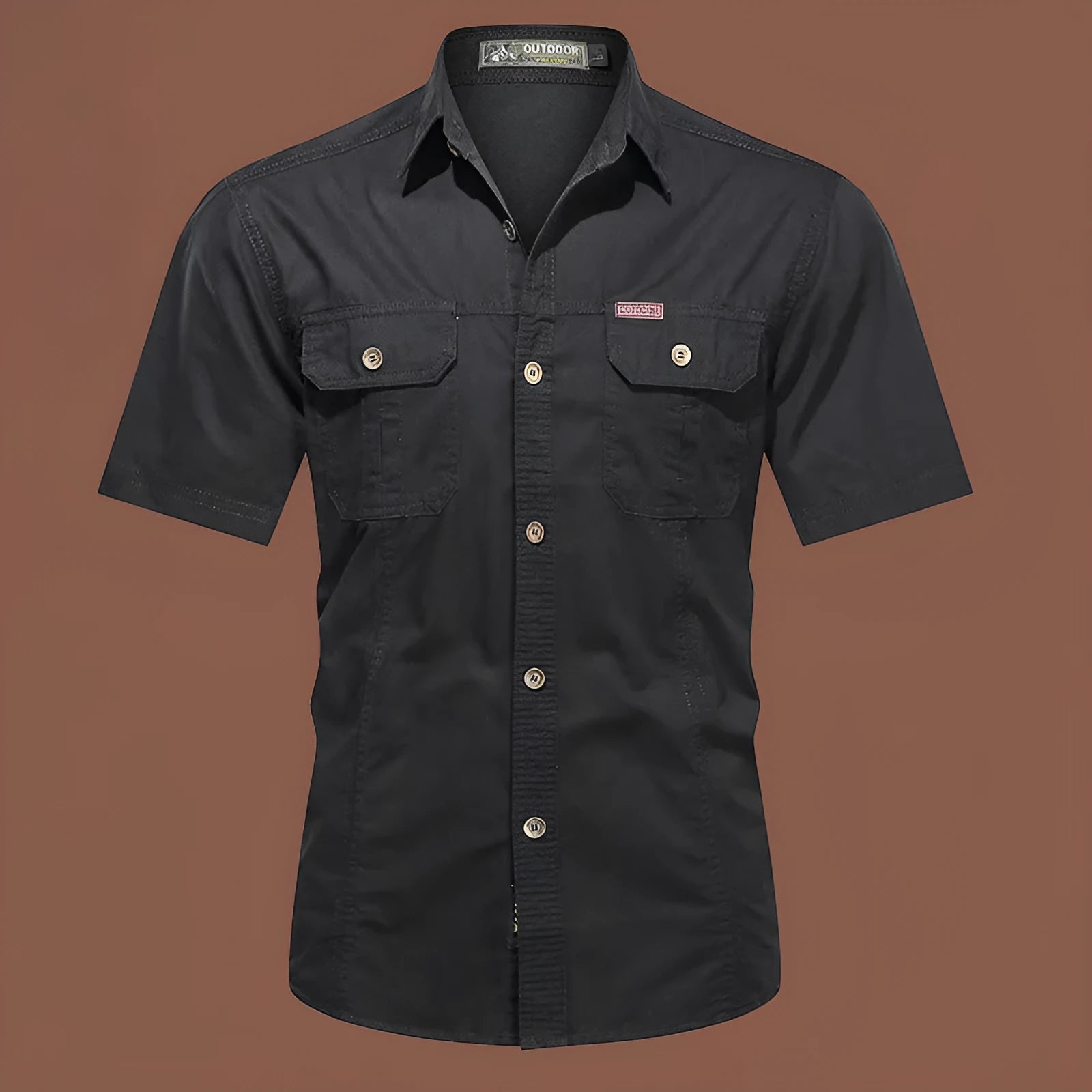 Man wearing a beige cotton short sleeve work shirt with a cardigan style and loose fit.