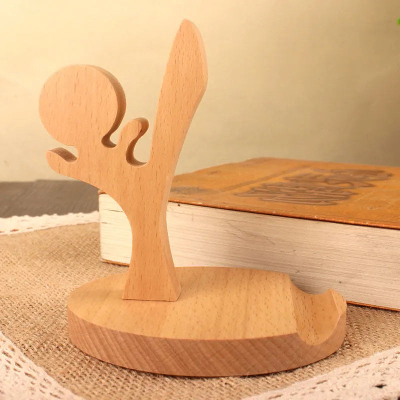 A decorative resin mobile phone stand holding a smartphone, shown in an animal design variant.