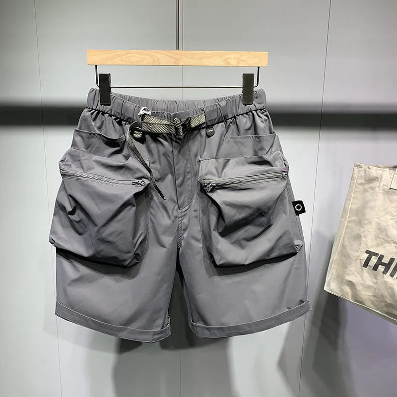 Large size men's work shorts in black with multiple pockets and straight leg design