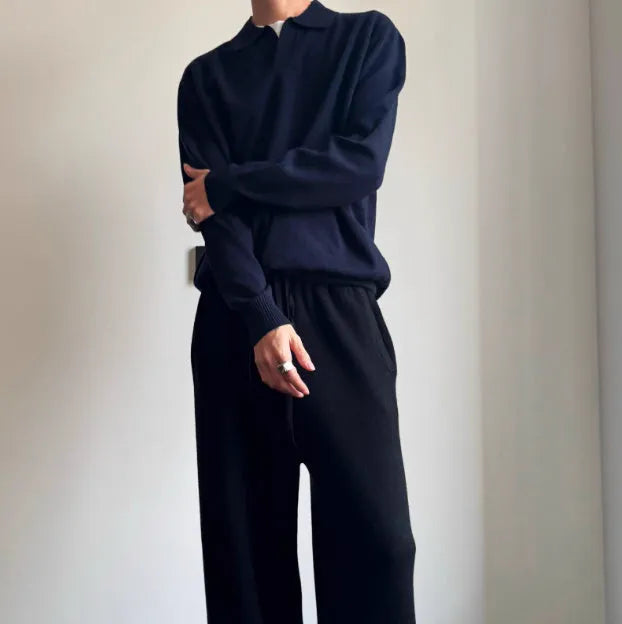 Man's pure wool polo sweater with lapel collar in loose fit, shown in milky white.