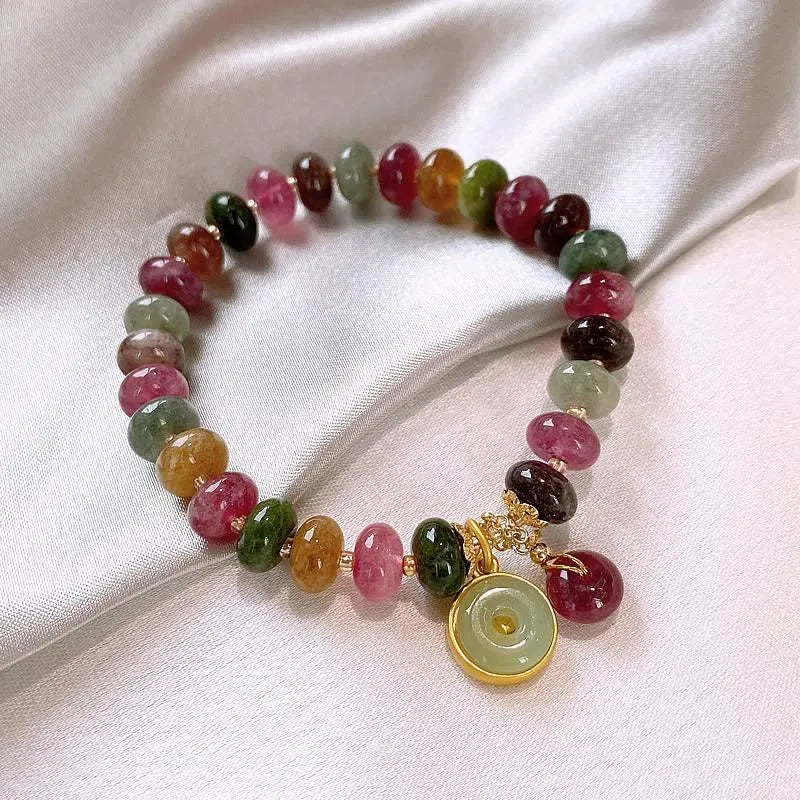 Natural stone abacus bead bracelet with a colourful tourmaline rabbit pendant.