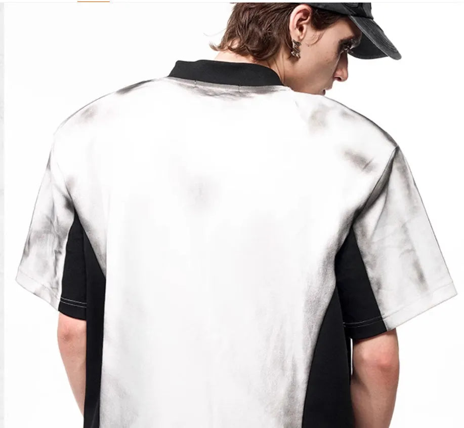 V-neck short sleeve top with snake letter pattern print and padded shoulders.