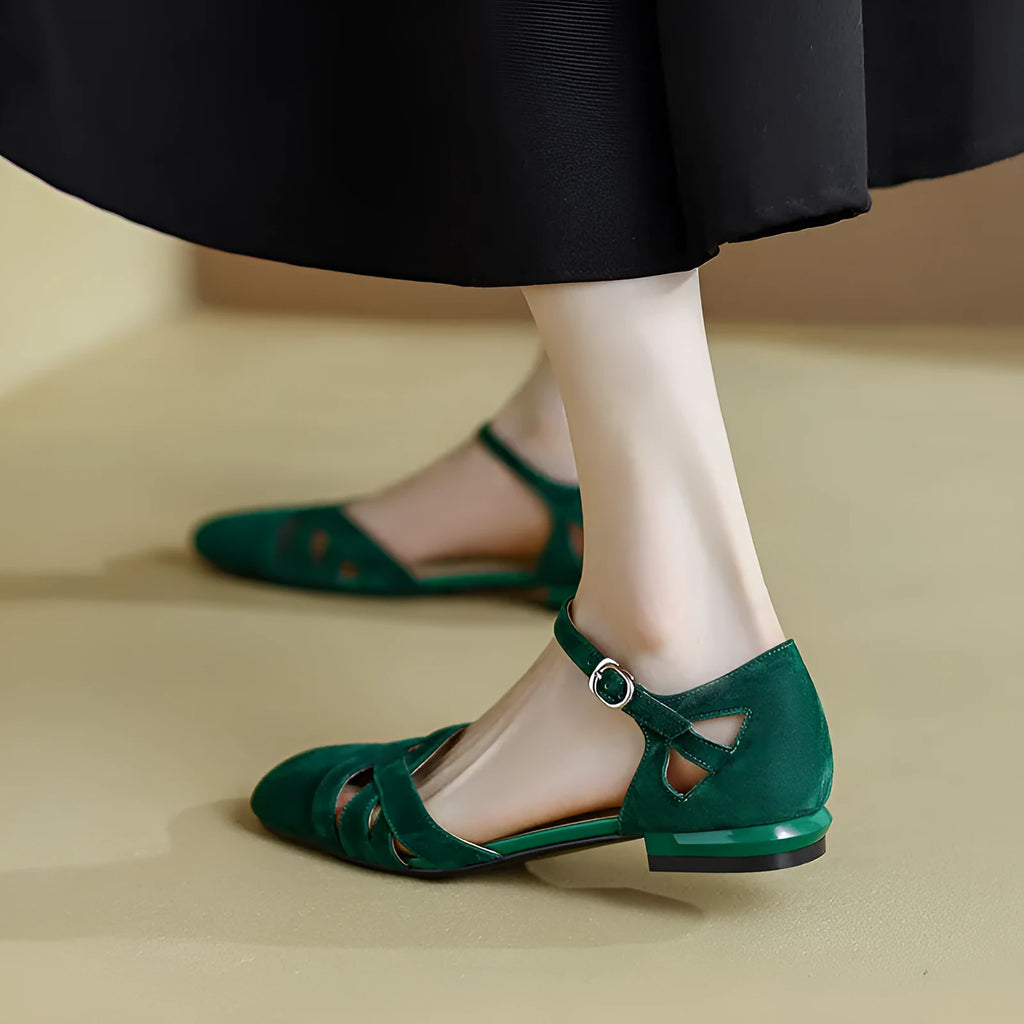 Women's apricot retro Roman sandals with a buckle closure and round toe on a light background.