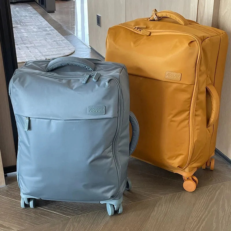 Tea brown coloured ultra-light waterproof Oxford cloth wheeled luggage suitcase in a 20-inch size.
