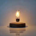 Magnetic levitation desk lamp with floating bulb on a solid wood colour base.