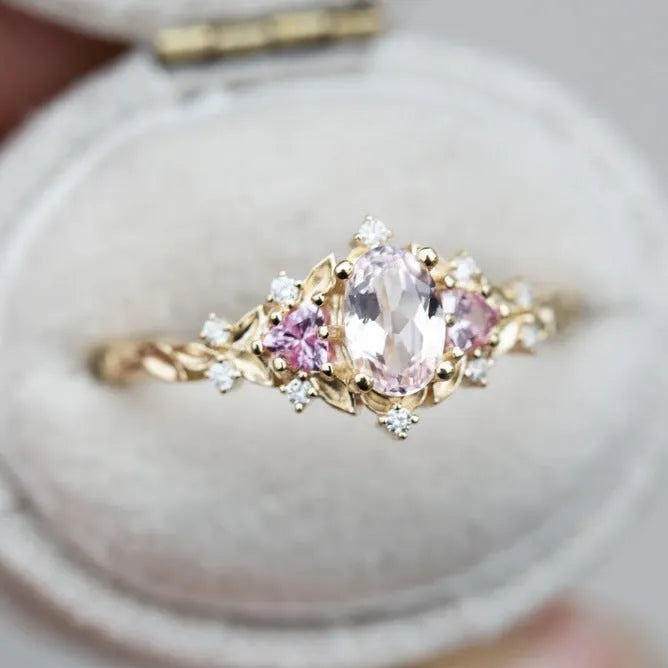 Women's alloy flower ring with inlaid zircon in gold pink diamond colour on white background