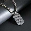 Men's titanium steel water ripple geometric pendant necklace on Emperor Chain in black, gold, or silver.