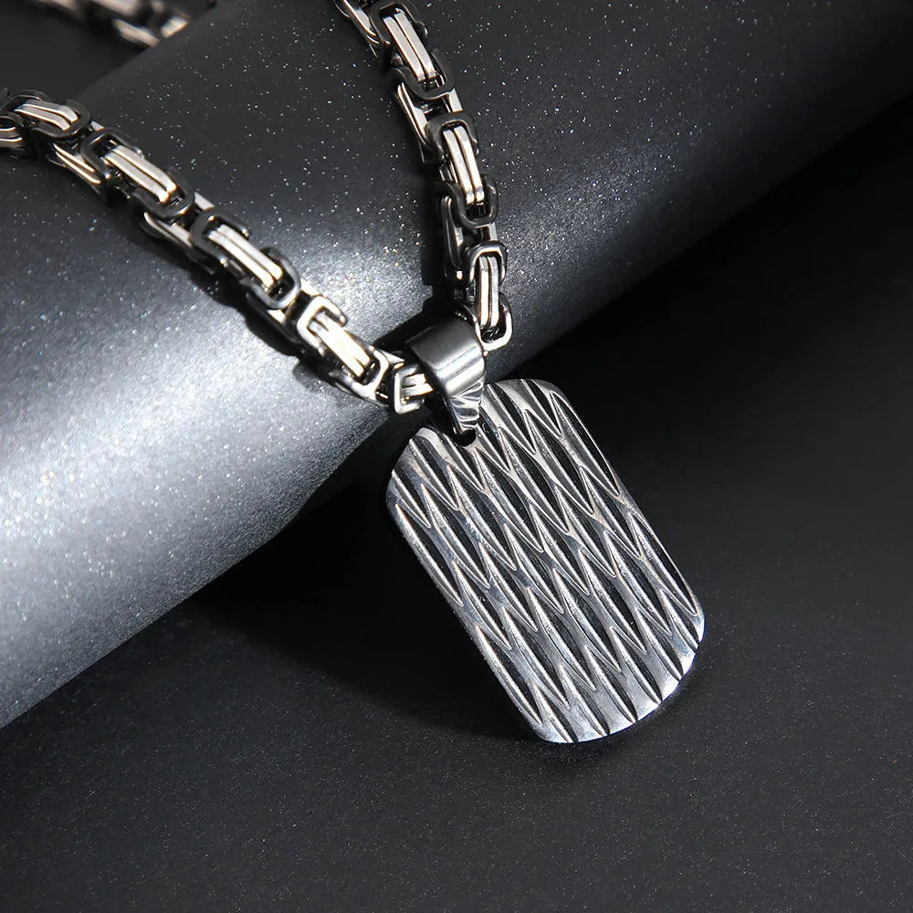 Men's titanium steel water ripple geometric pendant necklace on Emperor Chain in black, gold, or silver.