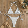 Women's gold lace-up bikini made from polyester fabric, shown on a size mannequin.