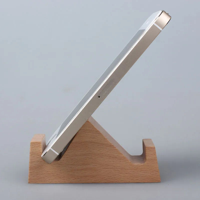 A decorative resin mobile phone stand holding a smartphone, shown in an animal design variant.