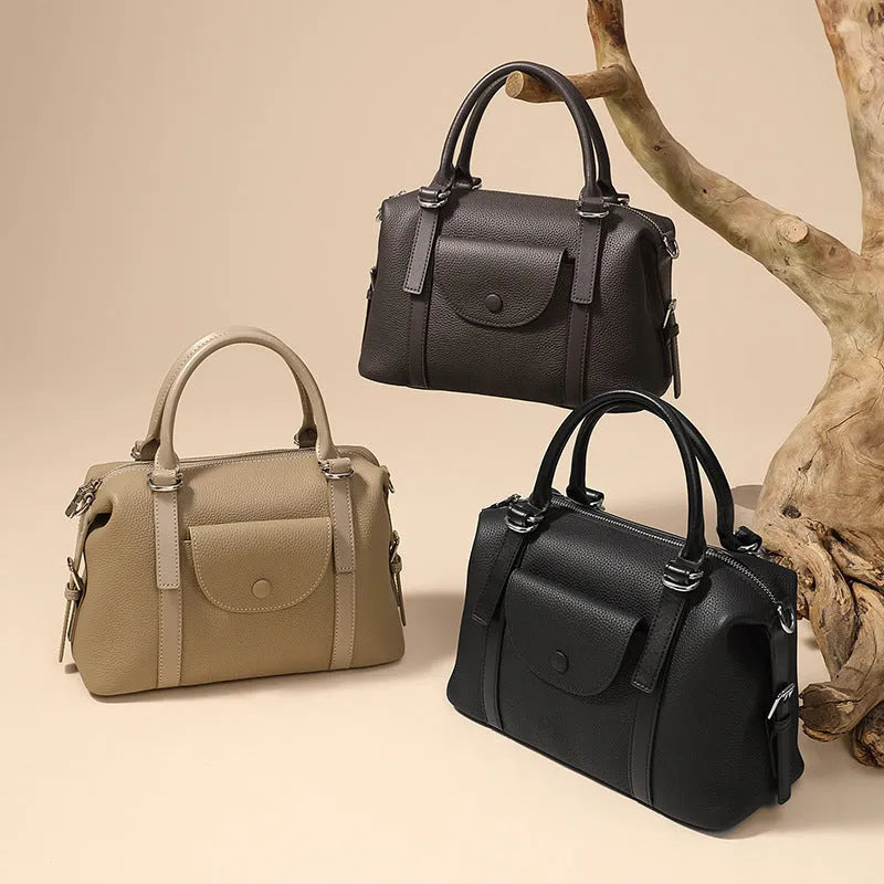 Genuine leather street trend ladies handbag with lock detail in black, brown, or elephant grey