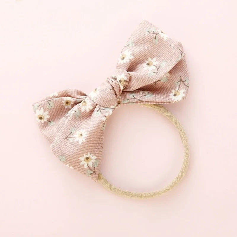 Children's knotted bow hair band in cloth fabric with six colour options