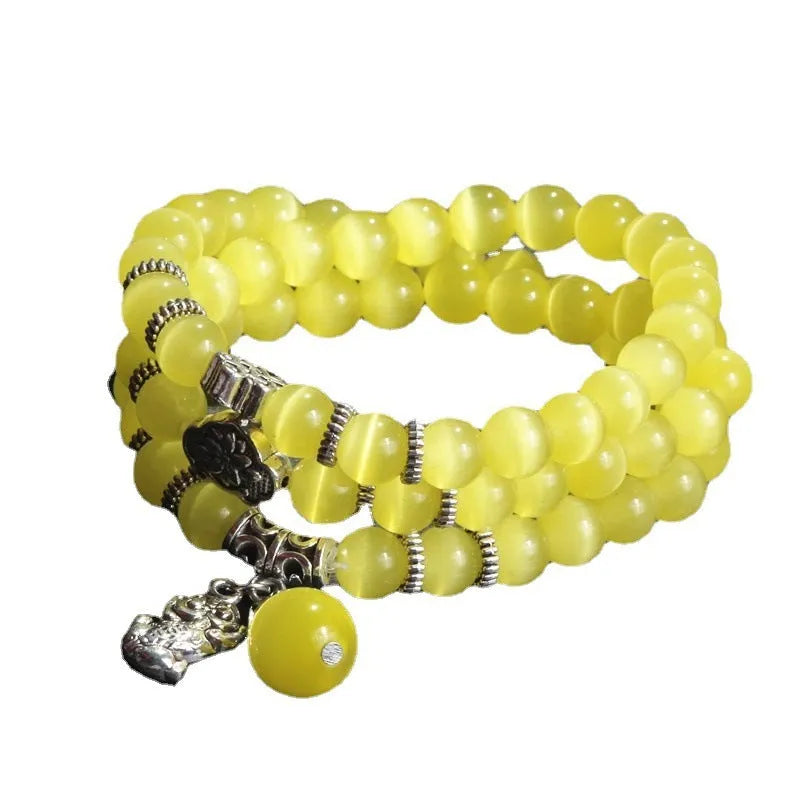 Opal crystal bracelet with geometric cat eye design showing three wraps around wrist