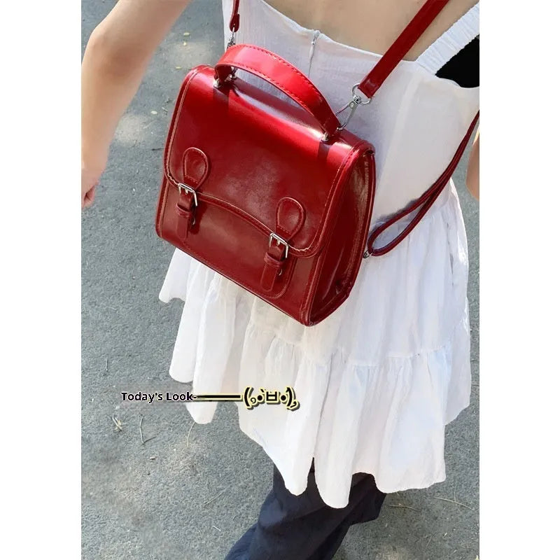 Simple PU backpack in urban college style, available in white, black, wine red, and silver, with polyester lining and sewing thread detail.