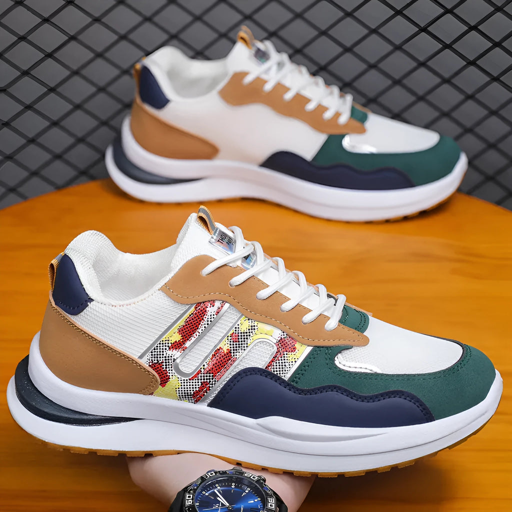 Men's white green mesh sports casual shoe with leather toe holder on a plain background.