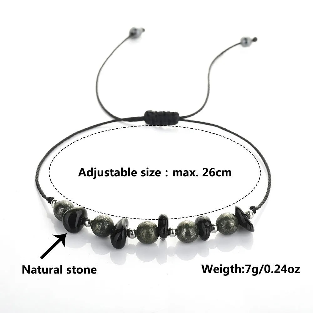 Black garnet stone bracelet with geometric beads and moon charm on wrist
