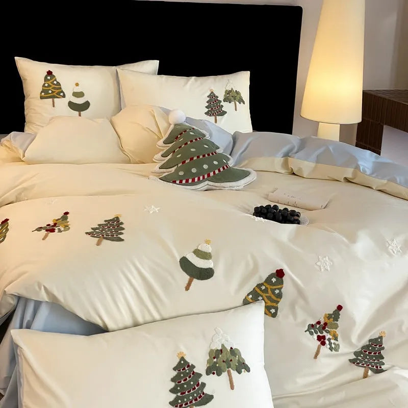 Cream blue duvet cover with raised towel embroidery Christmas tree design, part of a pure cotton four-piece bedding set.