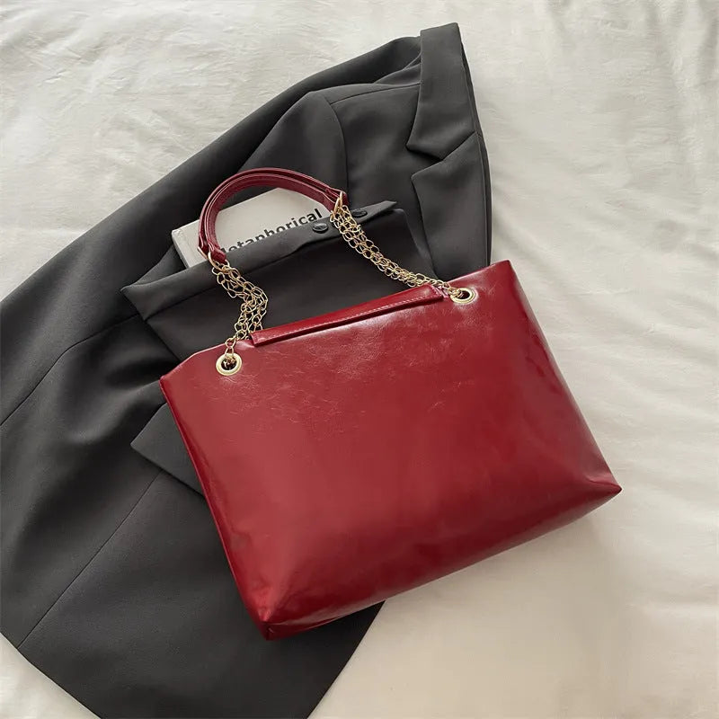 Large capacity chain shoulder bag for women in black, soft PU, horizontal square shape with chain strap