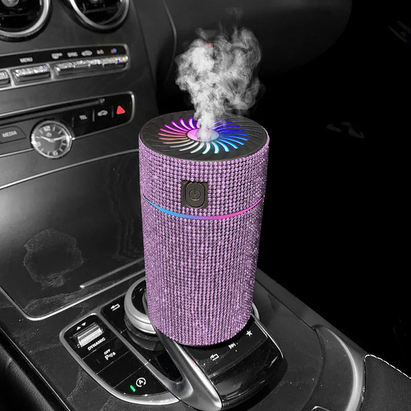 Compact white car air purifier humidifier with USB cord on car dashboard