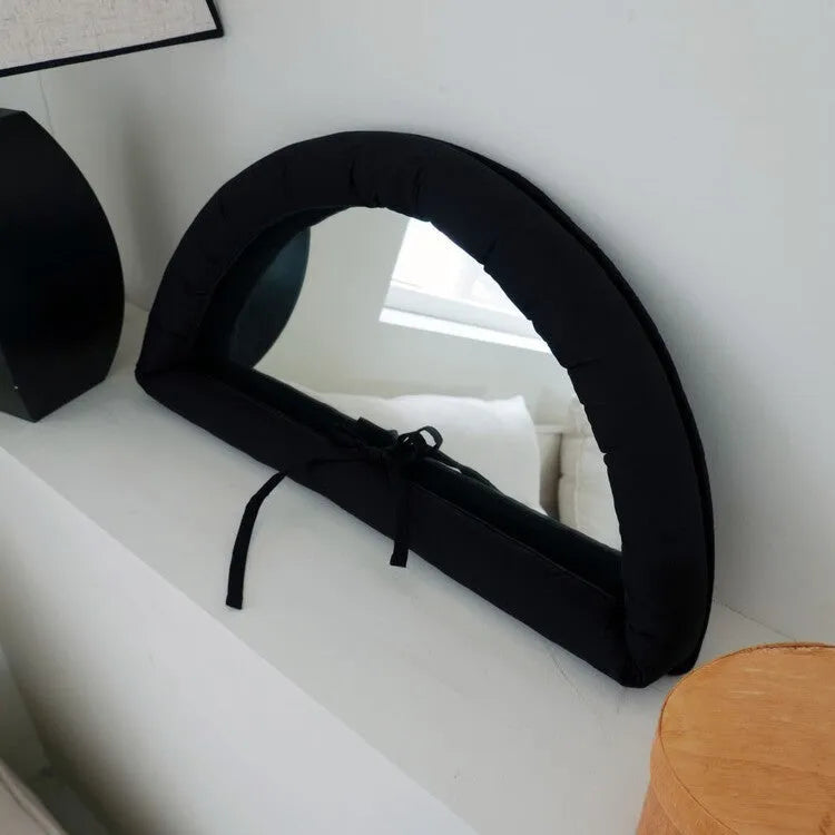 Soft cotton-filled hanging mirror in modern solid colour design