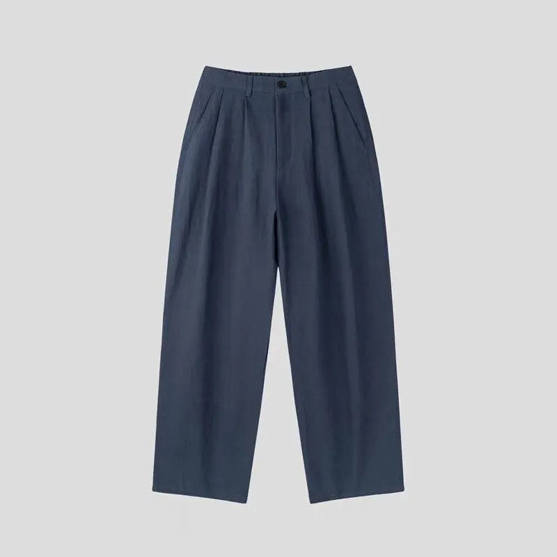 Men's loose-fit apricot coloured cotton linen blend trousers with a straight leg and elastic waistband.