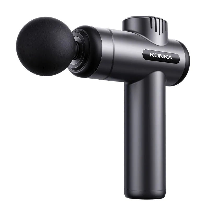 Konka V19 grey professional electric massage gun with multiple silicone massage heads on a table