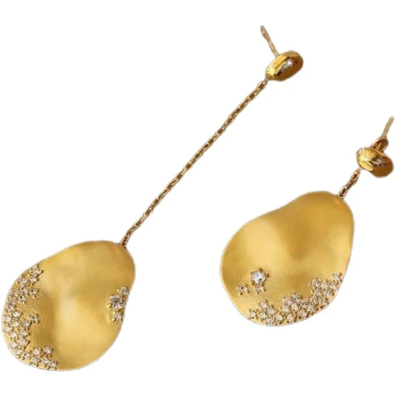 Asymmetric floral earrings with zircon crystals in gold or silver colour options