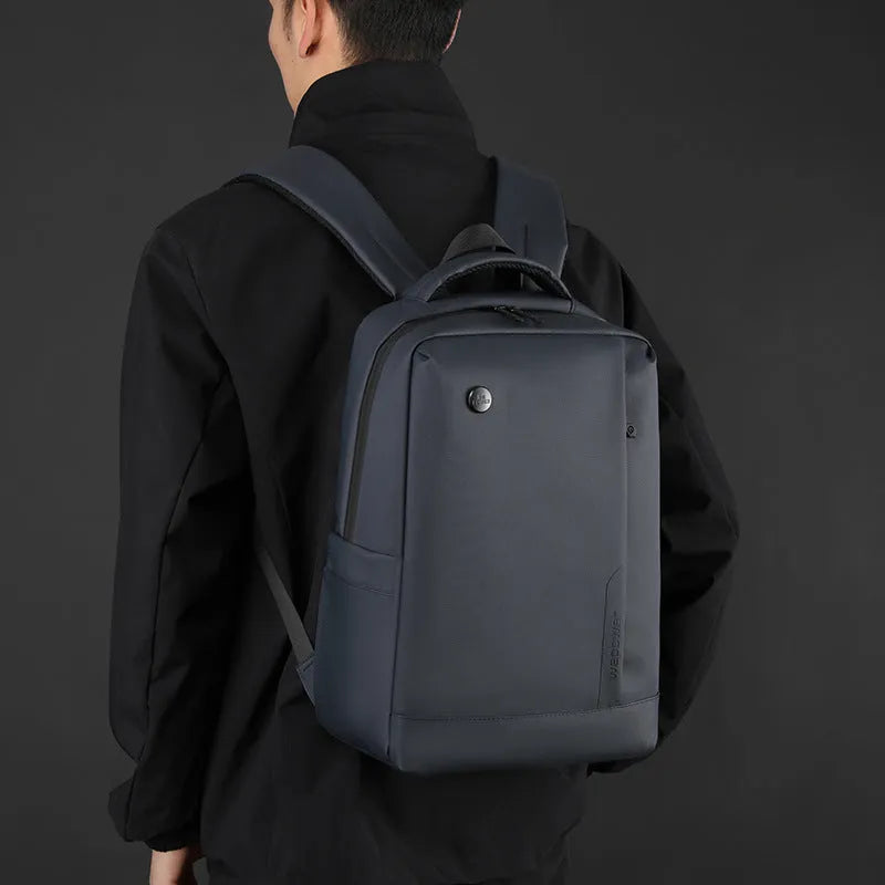 Men's large capacity nylon computer backpack in black with curved shoulder strap and polyester lining