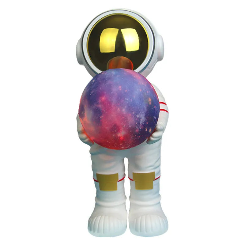 Spaceman starry sky projection lamp showing six-colour LED lighting on dark surface