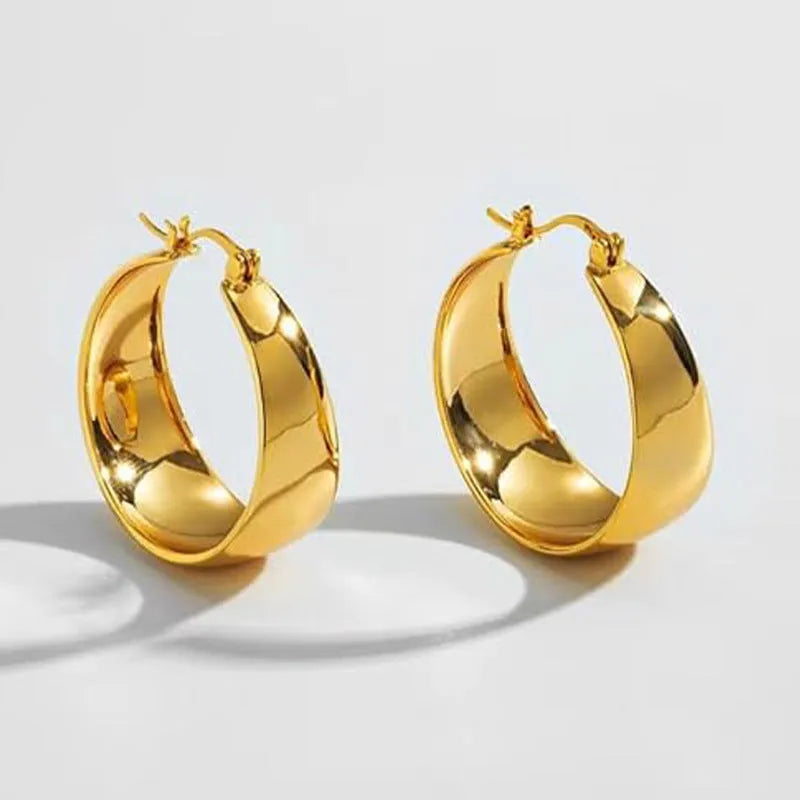 Widened curved stainless steel earrings in gold or steel colour with 25mm and 30mm size options