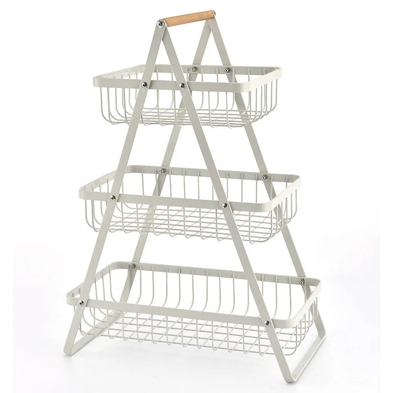 Black detachable double-layer iron fruit basket with wooden handle on tabletop