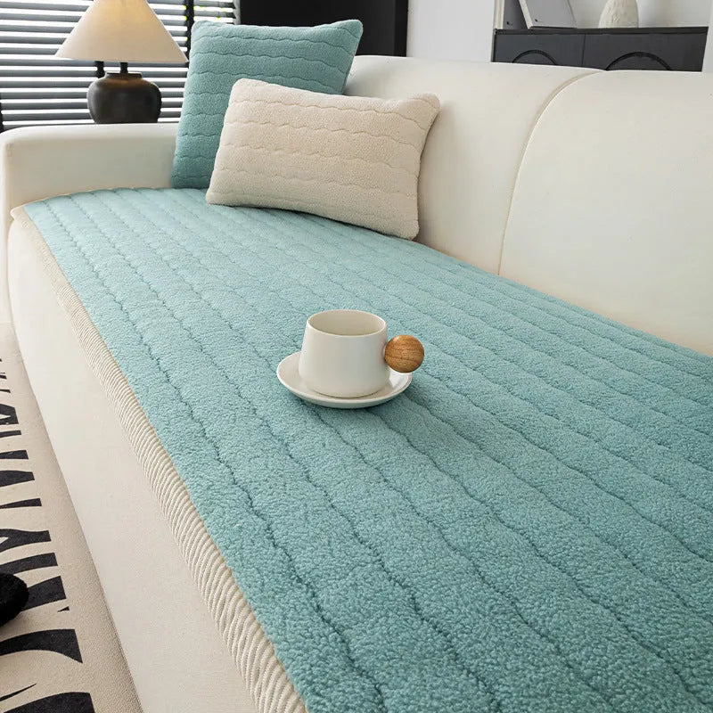 Thickened plush fleece sofa cover in beige on a couch, straight row design, dust protection cover