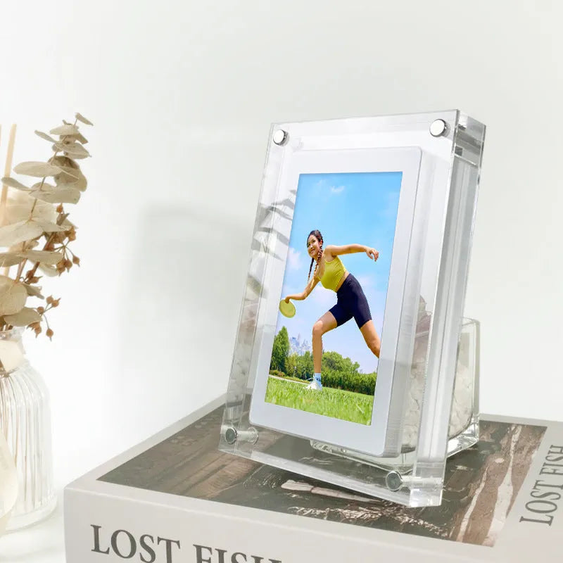 White vertical digital picture frame with 5-inch screen showing family photos