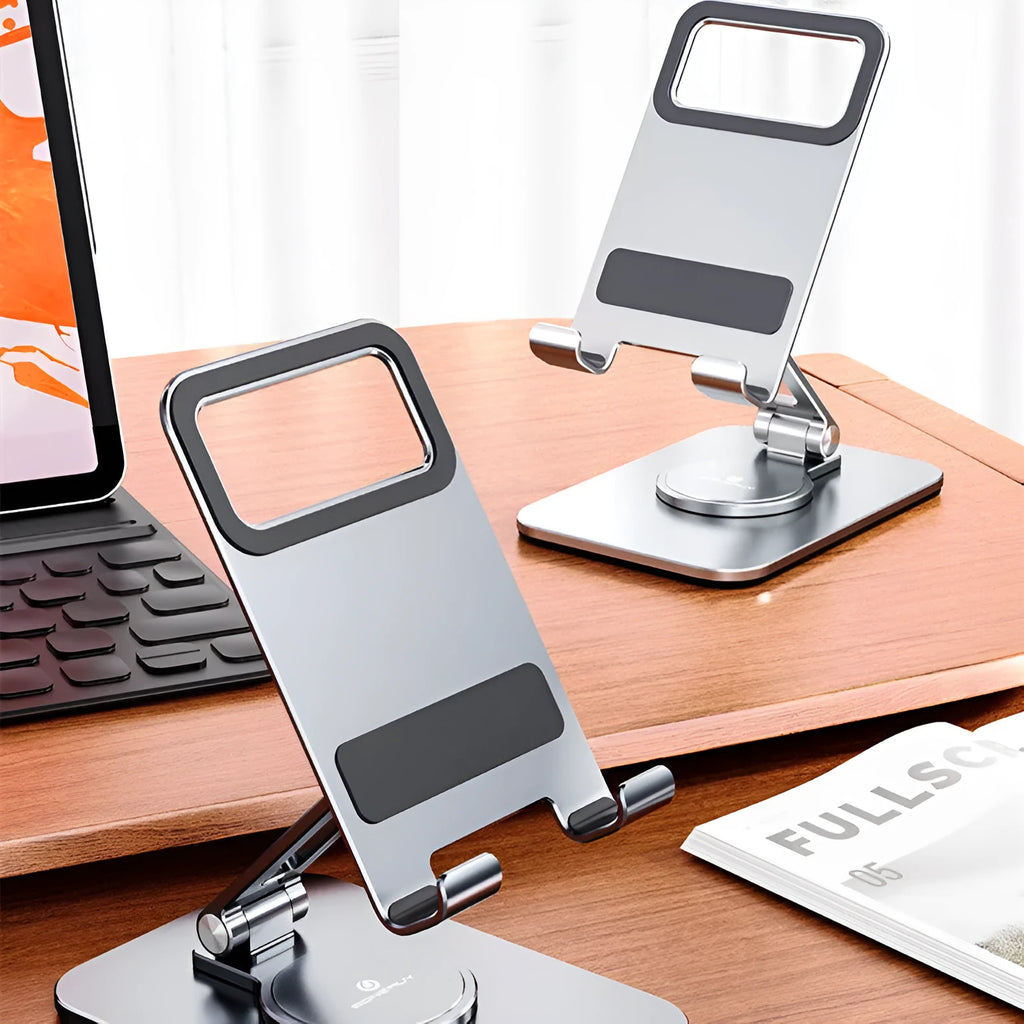 Folding aluminium alloy mobile phone stand in silver on a desktop showing rotary orientation
